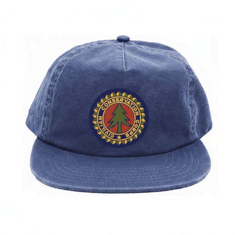 Blue vintage tree patch hat featuring a round emblem on the front