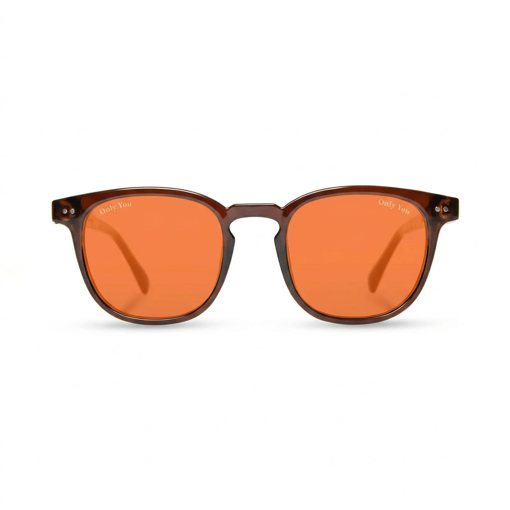 A pair of round sunglasses with translucent dark brown frames and vibrant orange lenses, shown against a plain white background.