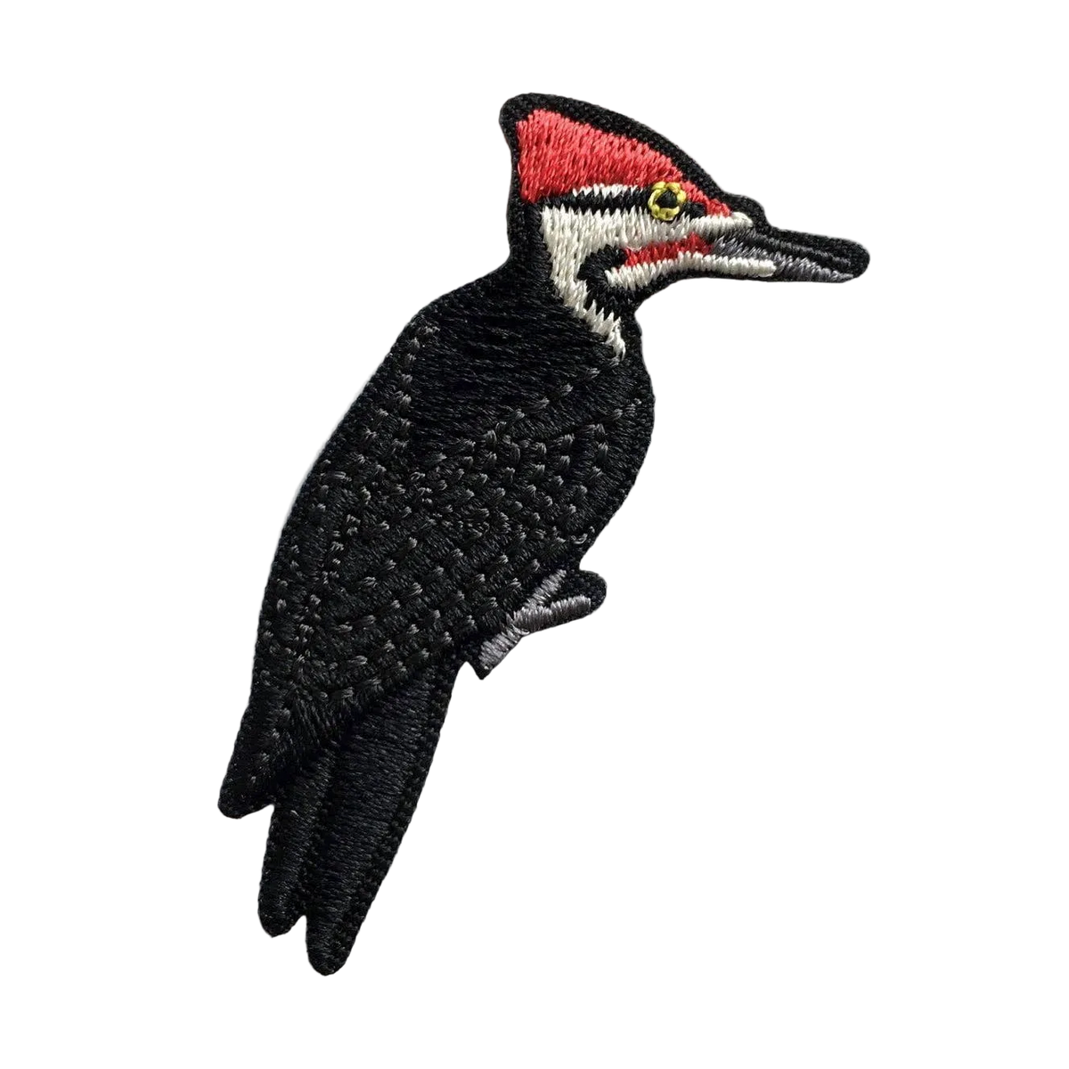 Embroidered Pileated Woodpecker patch with black body red crest and white facial stripe.