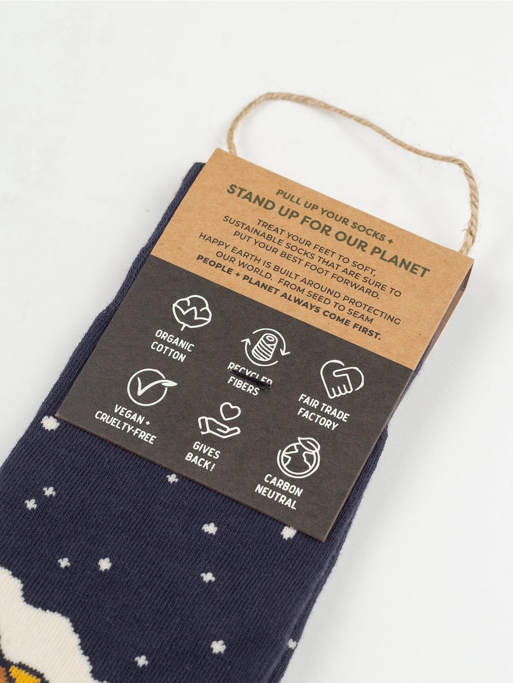 Navy Starry Night Socks with white specks and a brown sustainability tag.