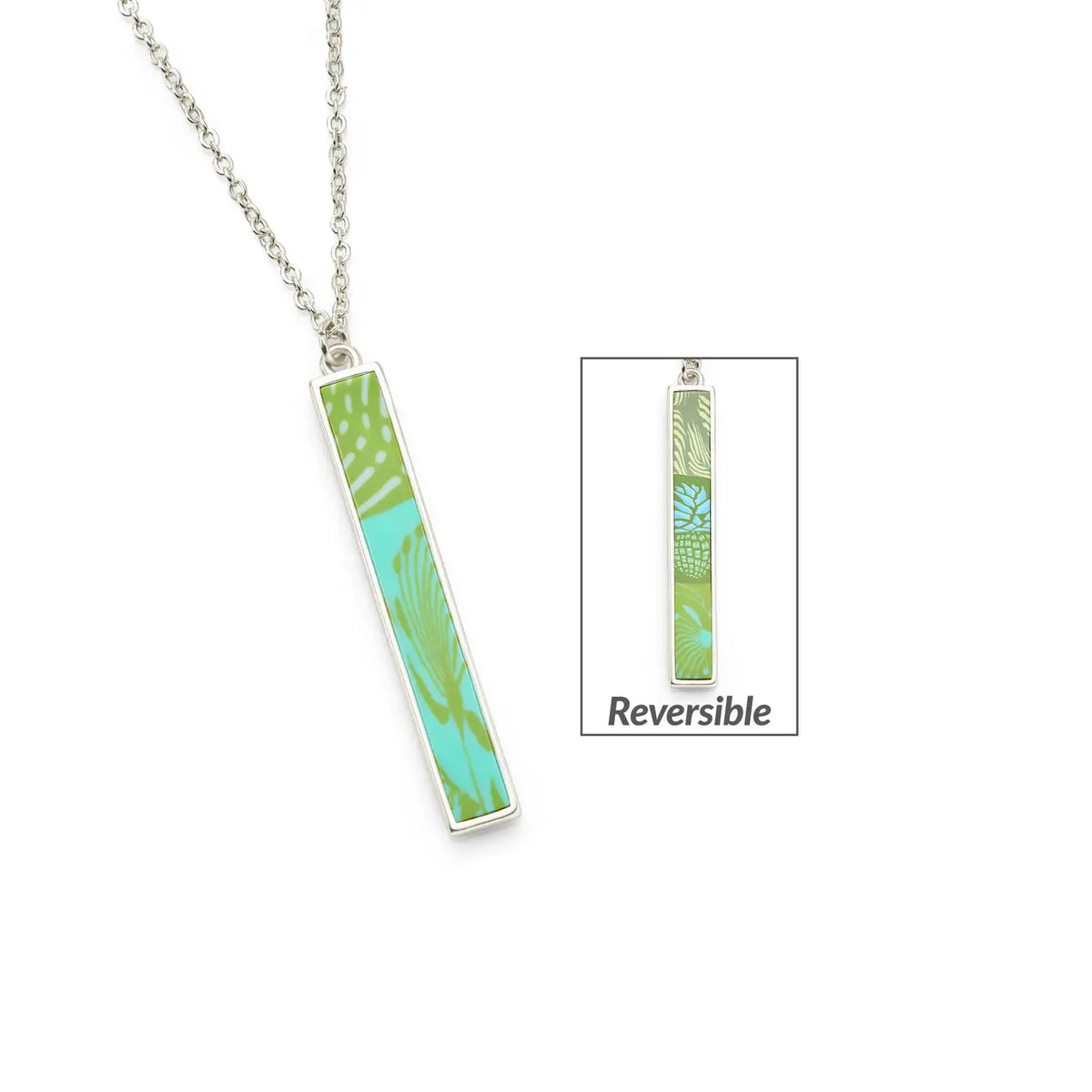 Vertical tropical green reversible bar necklace pendant on a silver chain with green and turquoise print.