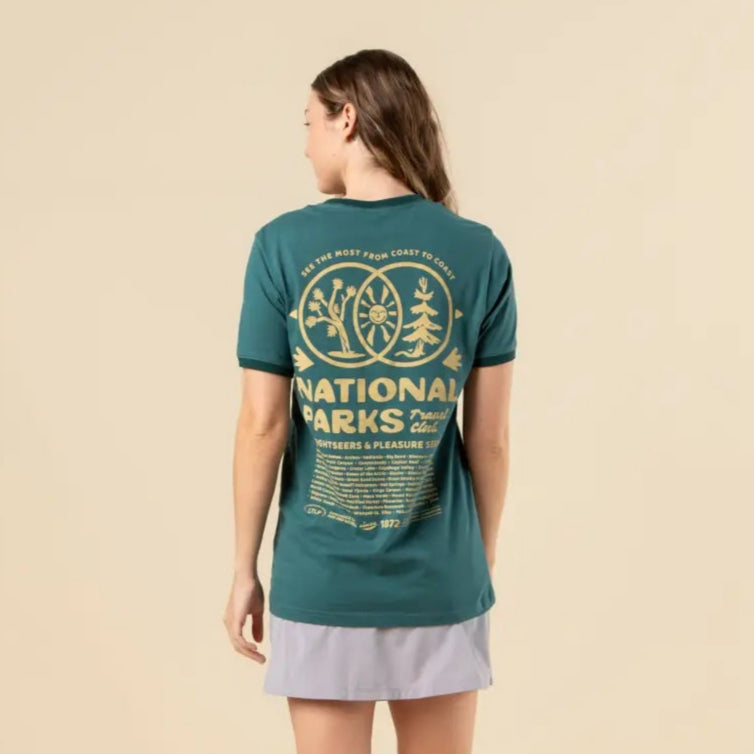 Back view of a model wearing teal National Parks Travel Club tee with a large cream graphic on the back