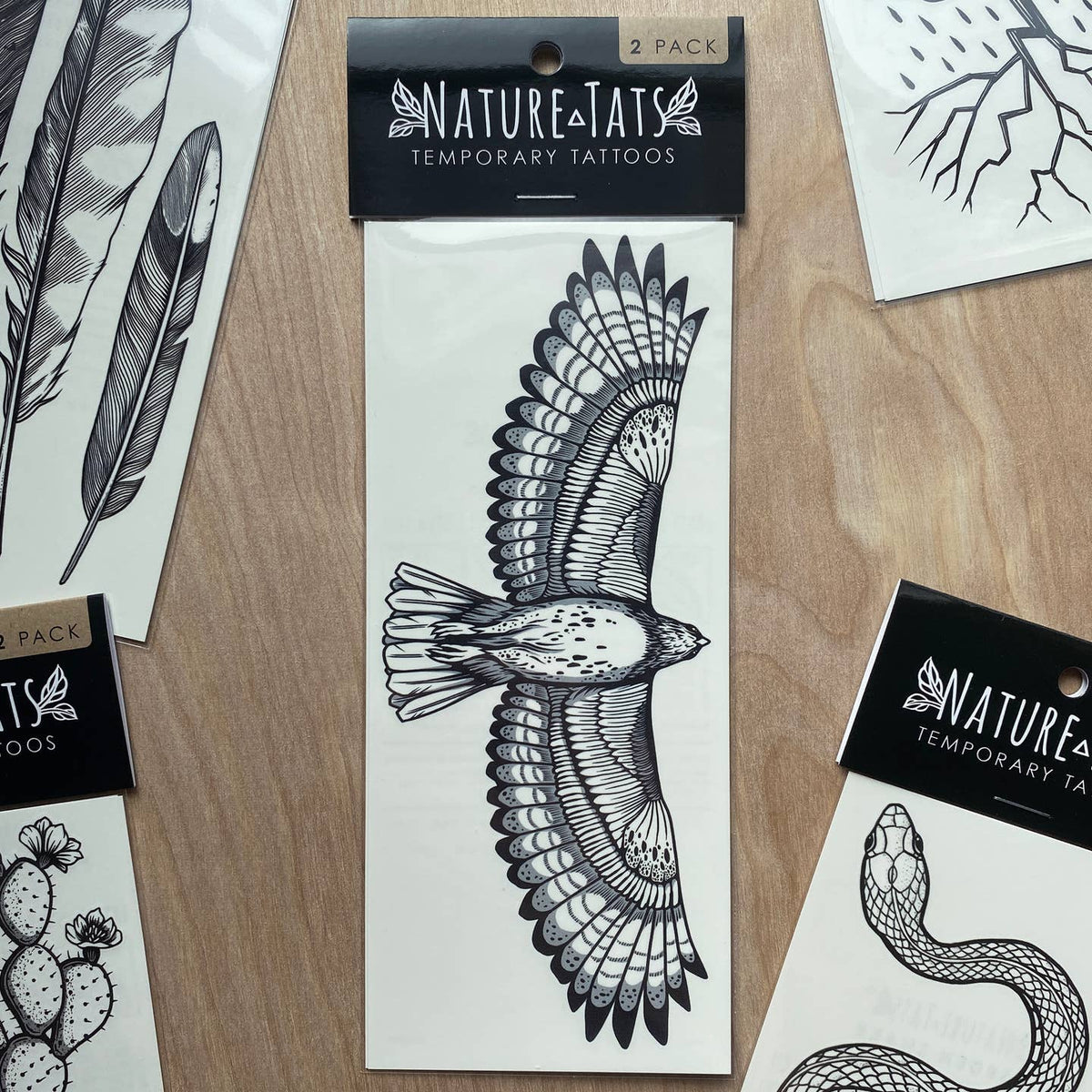 Two pack Nature Eats temporary tattoos package featuring a large black wing design.