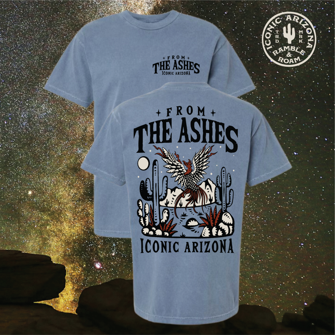 Product shot of two blue From the Ashes T shirts against a starry backdrop showing a large back graphic of a phoenix desert scene and Iconic Arizona