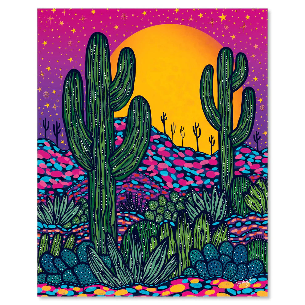 Midnight desert art print with tall cacti beneath a purple sky and a bright orange sun setting behind the hills.