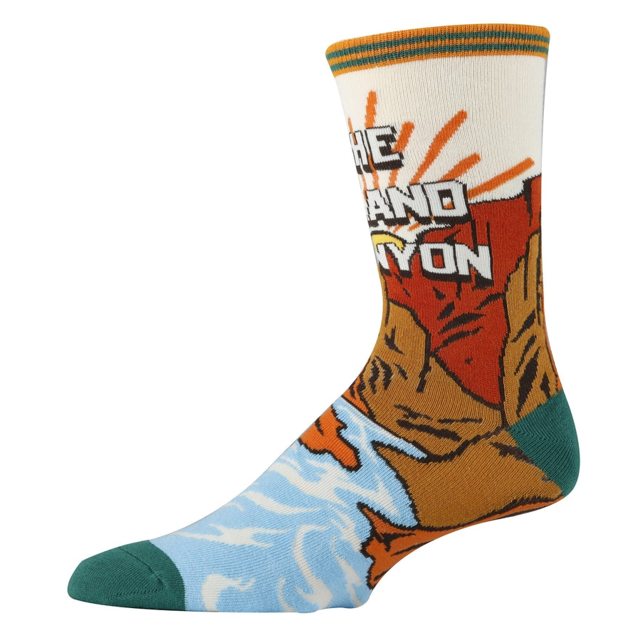 Knee high sock with a bold Grand Canyon desert scene in orange, brown and teal.