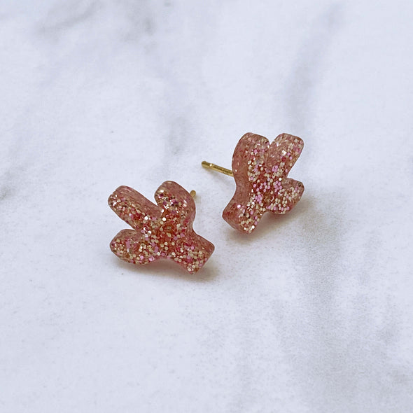 Pink glitter cactus stud earrings with gold posts