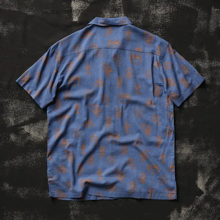 Blue casual button-down shirt with brown desert cactus doodles laid flat