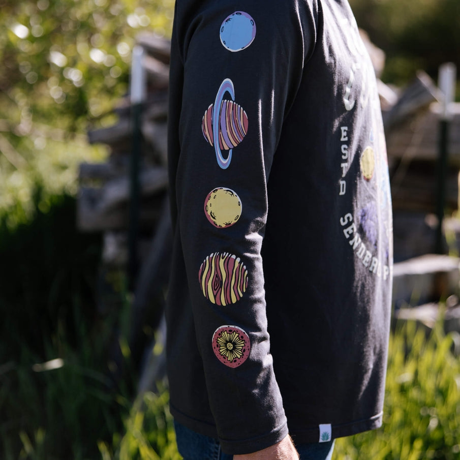 Cosmic Cowboy long sleeve black shirt with colorful planet patches along the sleeve