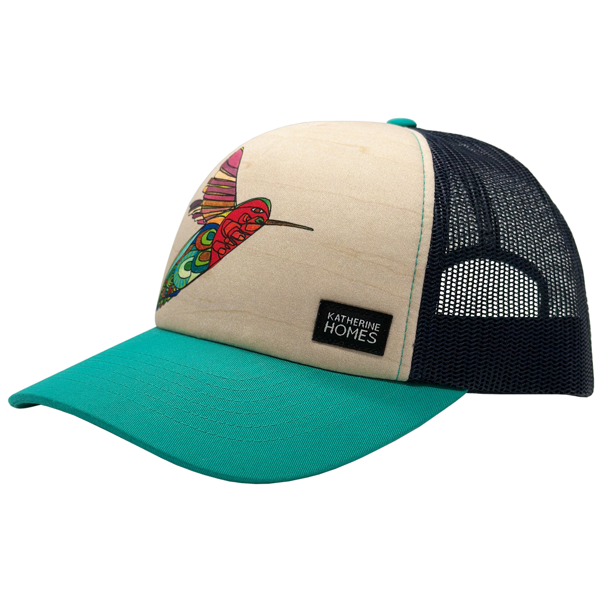 Beige foam front trucker hat with a vibrant hummingbird graphic, teal brim, black mesh back, and Katherine Homes label