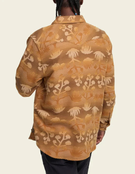 Back view of Sheridan Flannel shirt in Maguey Mirage with tan and orange tropical leaf pattern.