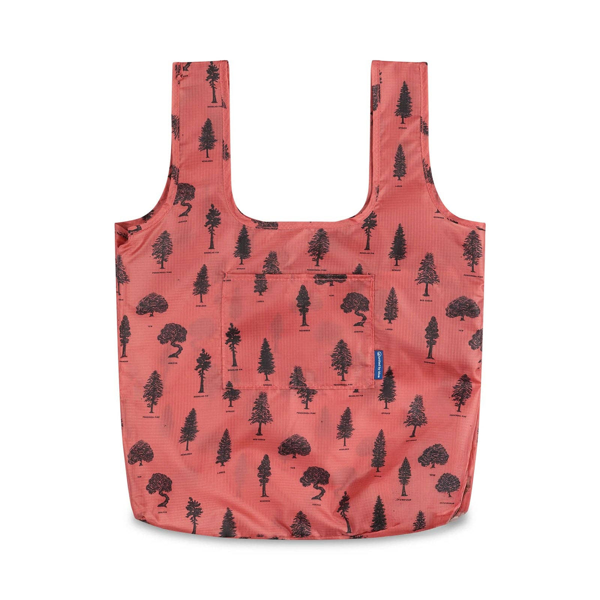 Coral packable tote with black tree silhouettes all over and a front pocket