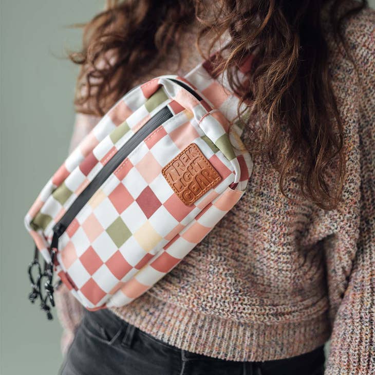 Everyday Fanny Pack in pastel checkered pattern worn by a person in a knit sweater