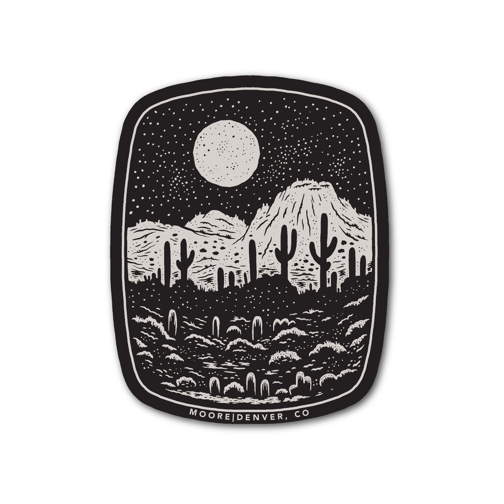 Desert Night Sticker in black and cream featuring a moonlit desert landscape with mountains and cacti