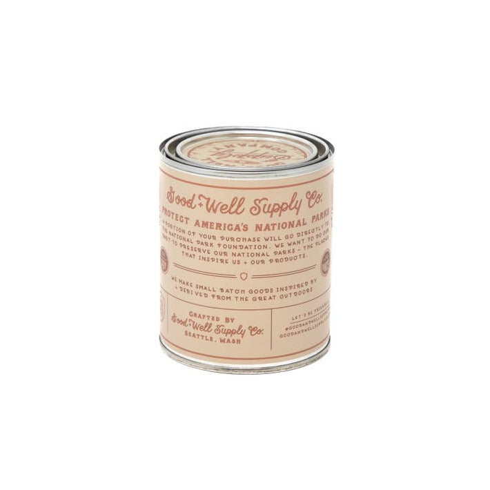 Grand Canyon National Park half pint candle in a metal tin with a peach vintage label bearing Good-Well Supply Co branding.