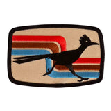 Beige retro patch with a black running roadrunner over multicolor stripes
