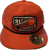 Orange red unstructured cap with a large embroidered patch featuring a sun and Eternal Summer text.
