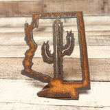 Rusty metal Arizona outline standee with a cactus silhouette cutout