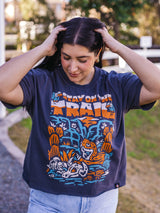 Person wearing navy Stay on the Trail boxy crop tee outdoors
