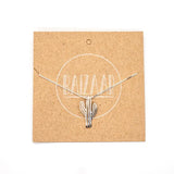Saguaro Cactus pendant necklace displayed on kraft card