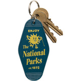 Blue National Parks keychain with a yellow sun graphic and brass keys attached