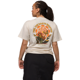Beige Parks Project T shirt back view with an orange butterfly floral graphic and the text Feel The Earth Breathe