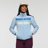 Light blue Cotopaxi Teca fleece full zip jacket worn by a model with color block chest panels.