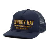 Front view of a navy blue mesh back cowboy hat with yellow COWBOY HAT embroidery