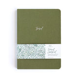 Olive green travel journal wrapped with a decorative leaf band.