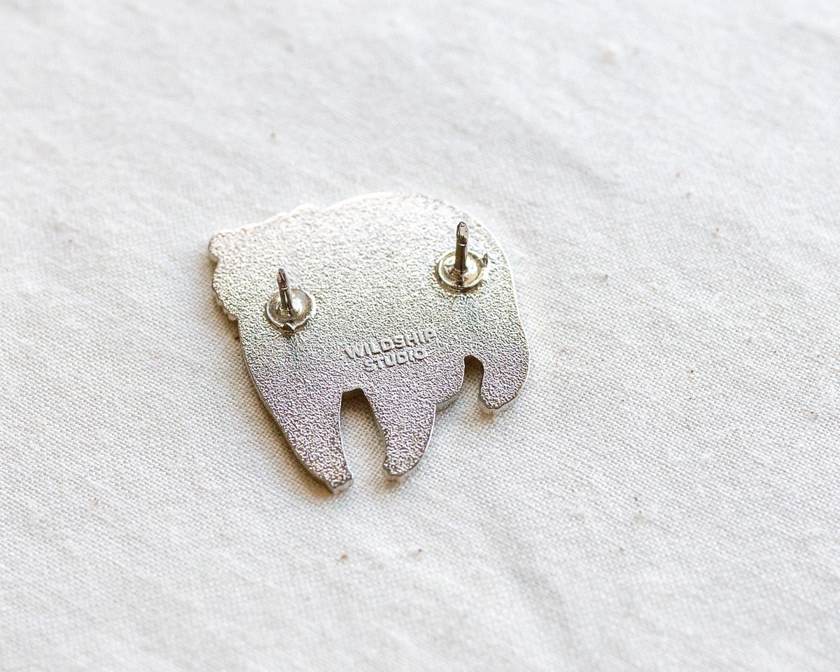 Back of Moon Bear enamel pin showing two posts and WILDOSHOP STUDIO imprint.