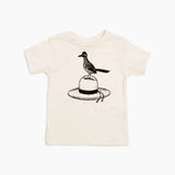 White toddler tee with a black line drawing of a roadrunner perched on a hat