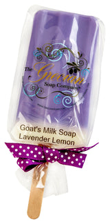 Lavender Lemon goat soap shaped like a popsicle wrapped in clear packaging with a purple ribbon.