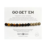 Go Get Em tiger eye aromatherapy bracelet displayed on a white card with beads along the bottom.