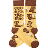 Yellow socks with brown toe and cuff featuring boots, flowers, and the line Forget Glass Slippers This Princess Wears Boots
