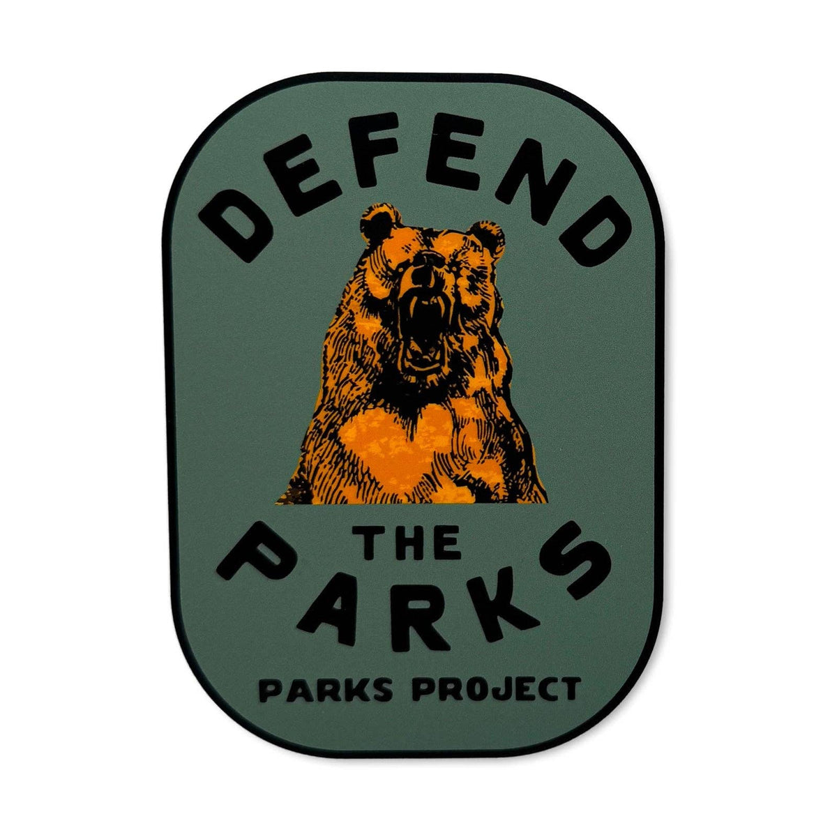 Defend the Parks sticker featuring a roaring orange bear on a green shield with the text DEFEND THE PARKS PROJECT.