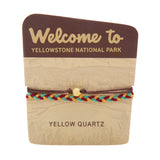 Yellowstone National Park bracelet with a multicolor braided band and a yellow quartz bead.