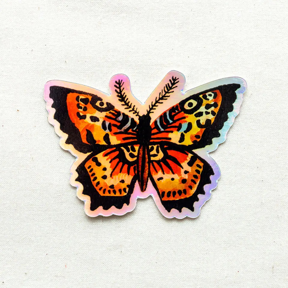 Holographic butterfly sticker with orange and black wings and pink edges