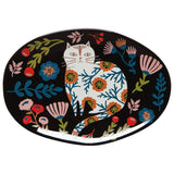 Catbloom Trinket Tray showcasing a white cat among vibrant flowers on a black oval surface.