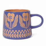 Blue Teppi imprint mug with orange floral motif and orange interior