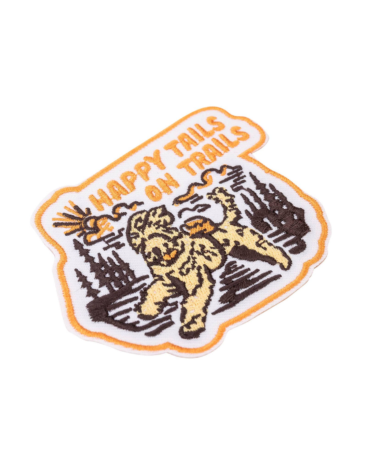 Close-up of patch edge with orange embroidered text Happy Tails on Trails