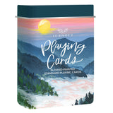 Colorful illustrated National Parks Playing Cards Travel Tin cover featuring mountains at sunset.