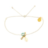 White braided rope Cowrie Charm Bracelet with a gold cowrie charm and sea themed accents