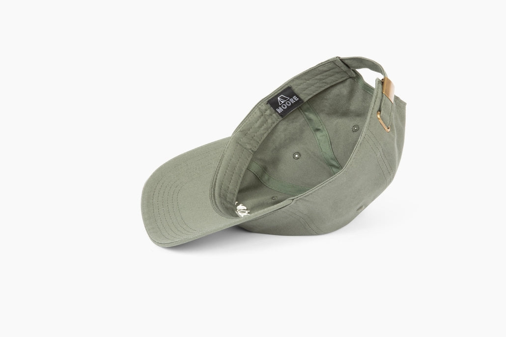 Saguaro Cactus hat in pine green with curved brim and interior label visible