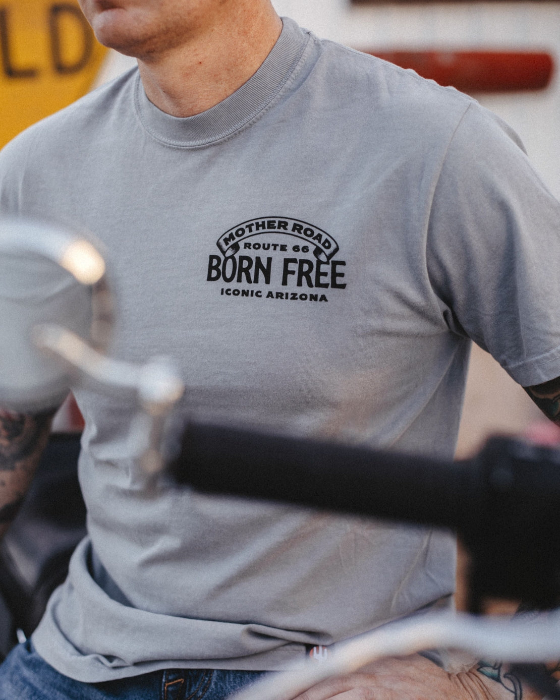 Gray Born Free tee with small Route 66 logo on the left chest
