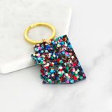 Acrylic Arizona keyring with multicolored glitter and a heart cutout