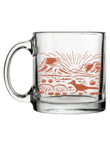 Desert Glass Mug with orange desert landscape including mesas and a coyote on clear glass.