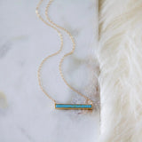 Gold chain necklace with a rectangular turquoise bar pendant