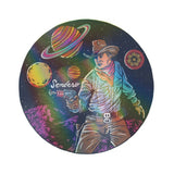 Circular holographic sticker showing a space cowboy with a gun amid colorful planets and a starry background