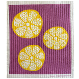 Lemon Slices Swedish dishcloth with yellow lemon rounds on a purple textured background