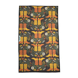 Western Bloom kitchen towel with yellow boots and white flowers among greenery on a dark background